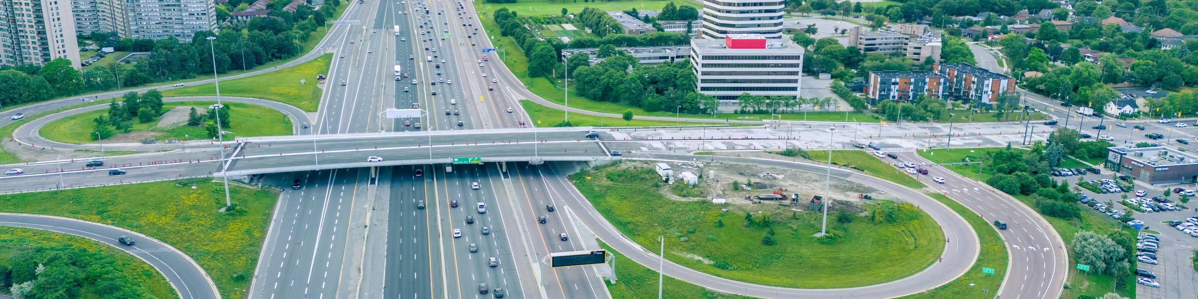 Canadian city highway with cars, representing national auto insurance comparison