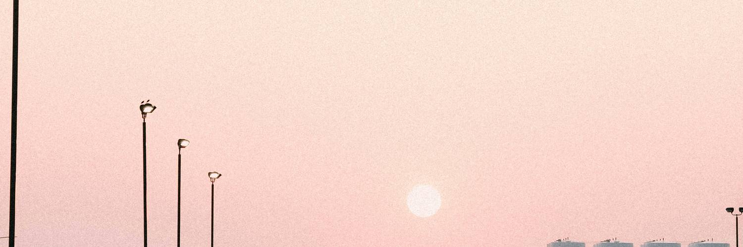 highway trucks sunrise||semi trailers road||prairie transport#|#Long-haul trucks driving through a sunrise on a Manitoba highway#|#manitoba-commercial-highway.jpg