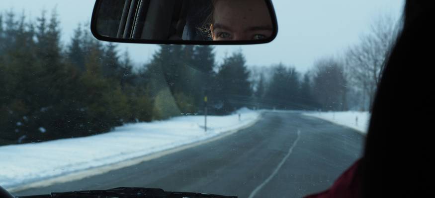 Teenage Manitoba driver learning about car insurance with parent