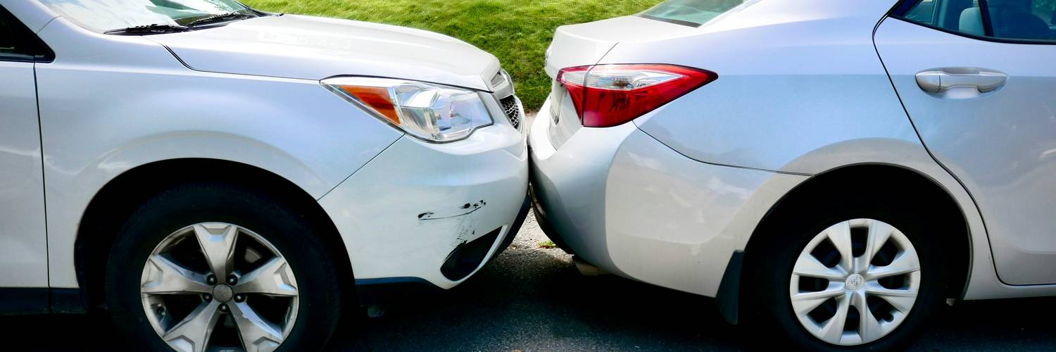 Car owner reviewing Manitoba auto insurance renewal documents at home