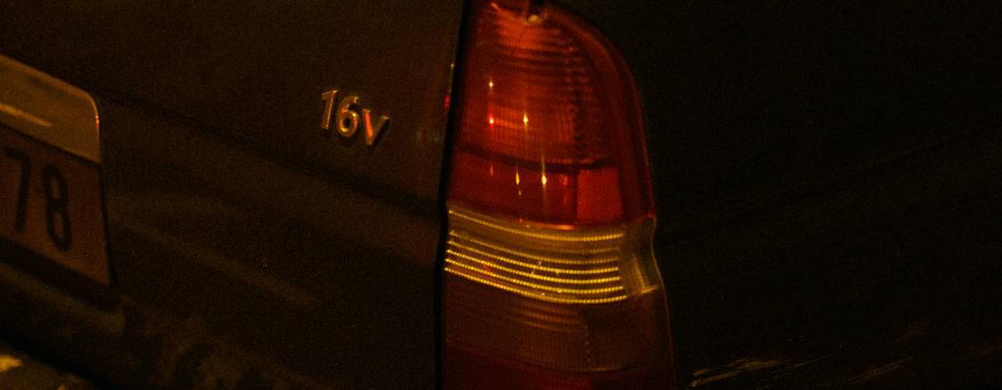 Damaged vehicle on a Manitoba street at night with police lights after a hit-and-run accident